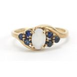 9ct gold opal and sapphire crossover ring, size H, 1.2g : For Further Condition Reports Please Visit