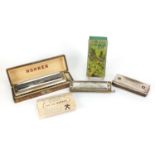 Three vintage harmonicas including The 64 Chromonica by Hohner, Super Chromonica by Hohner and