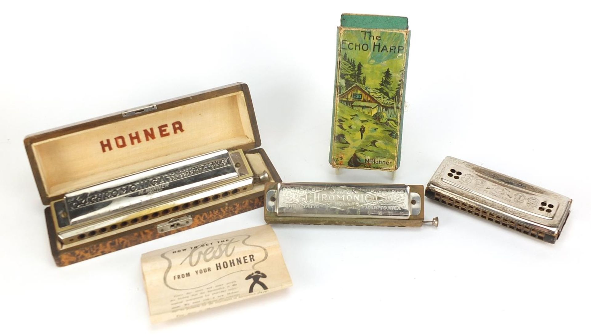 Three vintage harmonicas including The 64 Chromonica by Hohner, Super Chromonica by Hohner and
