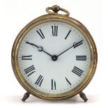 Circular brass desk clock with enamel dial having Roman numerals, 11cm high : For Further