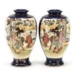 Pair of Japanese Satsuma pottery vases hand painted with figures, character marks to the bases, 16.