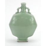 Chinese porcelain octagonal moon flask with twin handles having a celadon glaze, four figure
