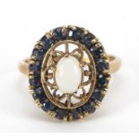 9ct gold opal and sapphire ring with pierced setting, size P, 5.2g : For Further Condition Reports