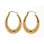 Pair of 9ct gold hoop earrings engraved with love hearts, 2.6cm high, 0.8g : For Further Condition