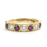 18ct gold diamond and ruby half eternity ring, the diamonds approximately 3.2mm in diameter, size R,