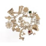 Silver charm bracelet and a selection of mostly silver charms including Venetian gondola,