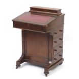 Victorian mahogany Davenport with tooled red leather insert, fitted interior and four drawers,
