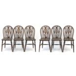 Set of six oak wheel back dining chairs, each 90cm high : For Further Condition Reports Please Visit