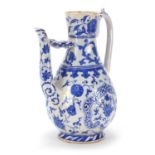 Turkish Iznik pottery water carafe decorated with flowers, 29.5cm high