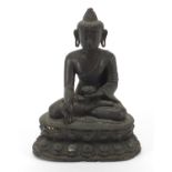 Chino Tibetan patinated bronze figure of seated Buddha, character marks to the interior, 16.5cm high