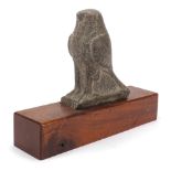 Large antique stone carving of a bird raised on a later wooden base, possibly Egyptian, 30cm high