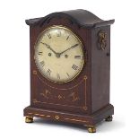 19th century inlaid mahogany bracket clock striking on a gong, having a circular painted dial with