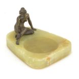 Art Deco onyx dish surmounted with a nude bronzed female, 13cm in length