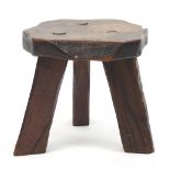 Naturalistic tripod stool with Wanderwood plaque to the underside, 30cm high