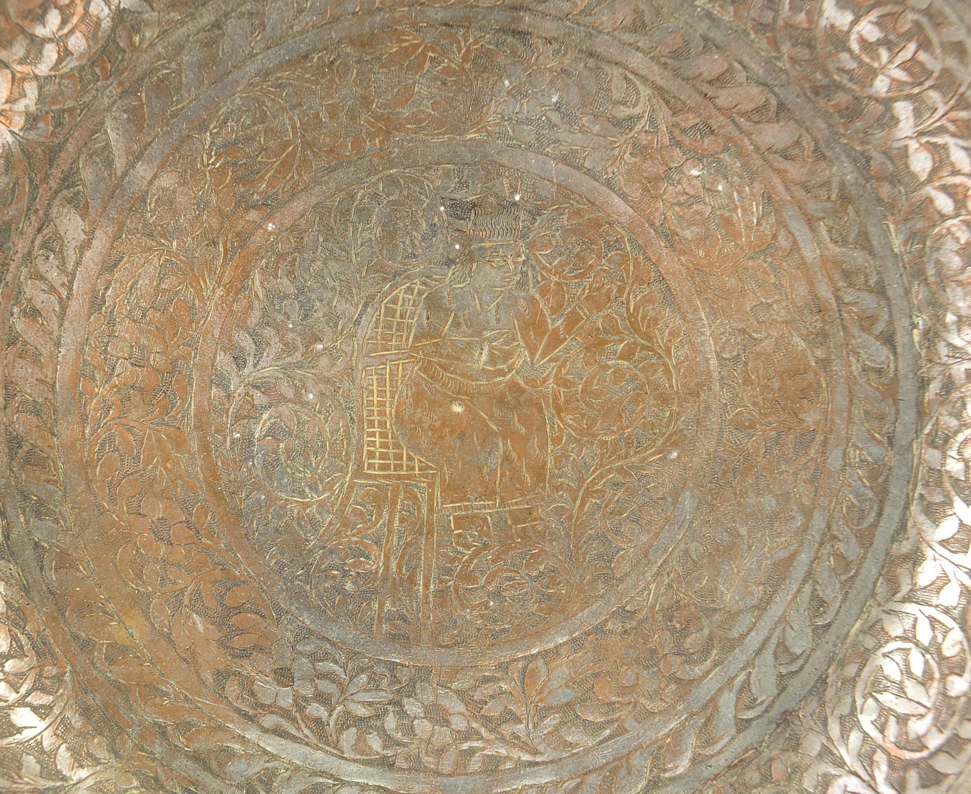 Turkish silvered copper dish engraved with a figure seated in the centre surrounded by flowers and - Image 2 of 5