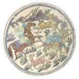 Turkish Kutahya pottery tile hand painted with warriors on horseback, 39.5cm in diameter