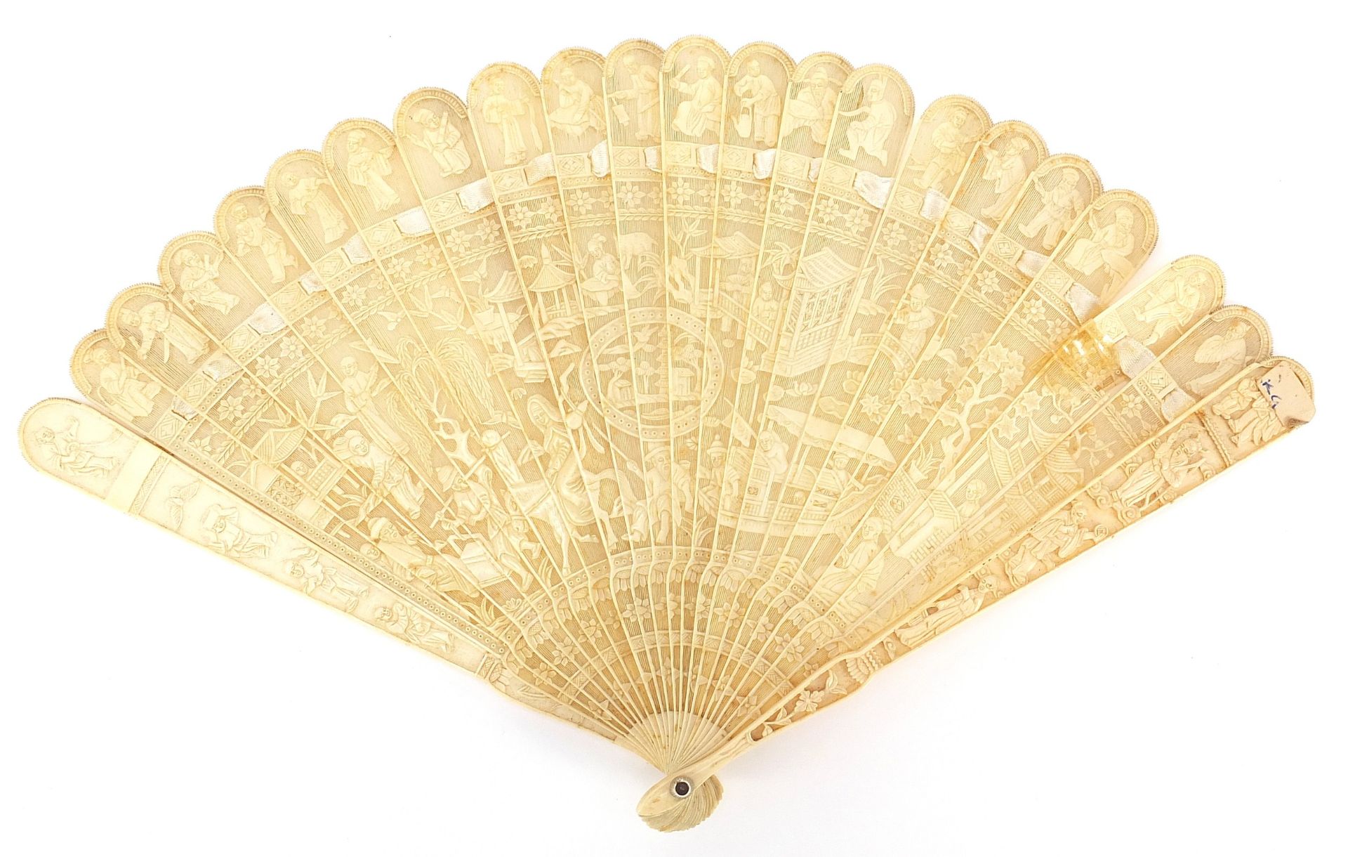 Chinese Canton ivory brise fan carved with figures amongst pagodas and in boats, 18cm in length when