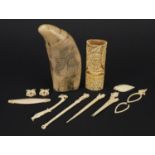 Ivory and bone objects including scrimshaw, the largest 13cm in length