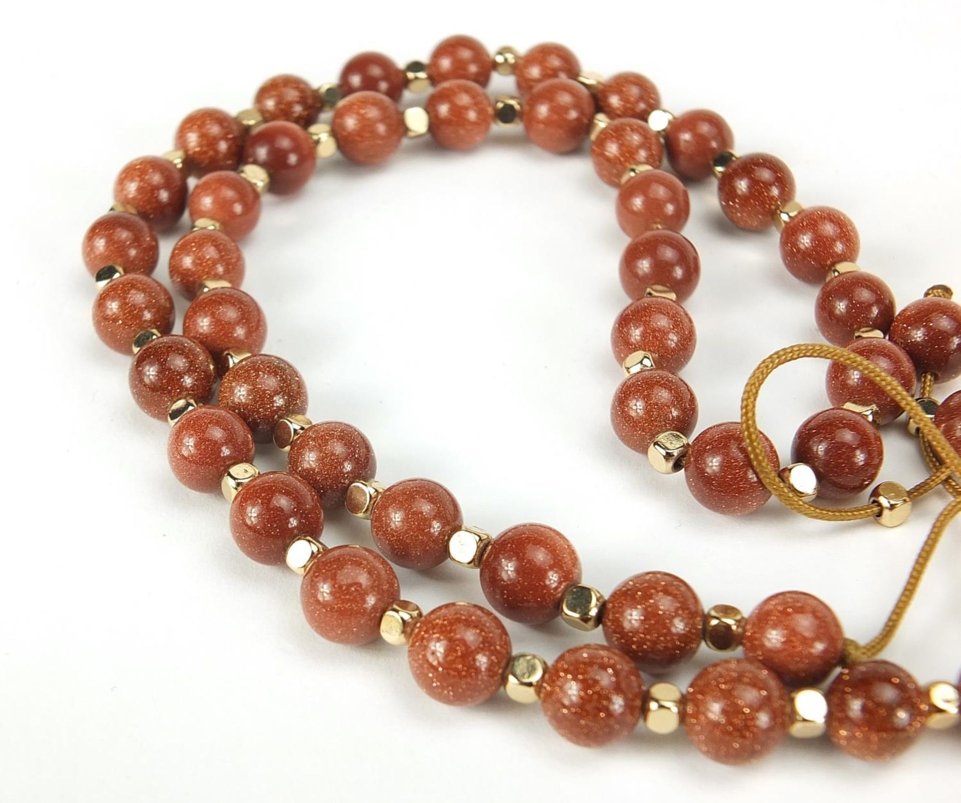 Four necklaces and an amethyst bracelet with 9ct gold clasp including goldstone and carnelian with - Image 6 of 6