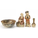 Japanese Satsuma pottery comprising two figures, bowl and garlic head vase, the largest 16.5cm high