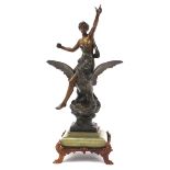 Large patinated bronze study of a female riding an eagle raised on an onyx base with gilt paw