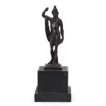 Antique patinated bronze figure of a nude figure with robe, raised on a square black slate base,
