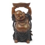 Large Chinese patinated bronze figure of Buddha with his hands above his head holding a vessel, 48cm