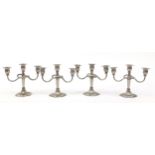 Two pairs of three branch candelabras, 21cm high