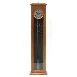 Oak cased floor standing electronic pendulum clock, silvered dial with Roman numerals, 128cm high