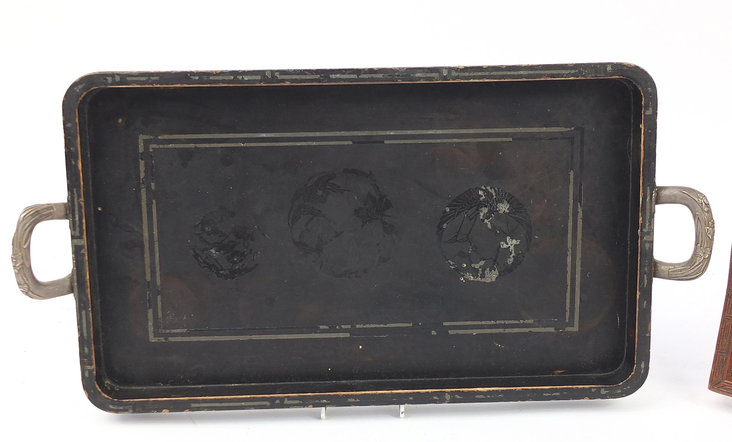 Two Japanese wooden trays, one lacquered in black and having white metal handles, the other having - Image 2 of 4