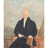 Three quarter length portrait of a seated gentleman holding spectacles, early 19th century