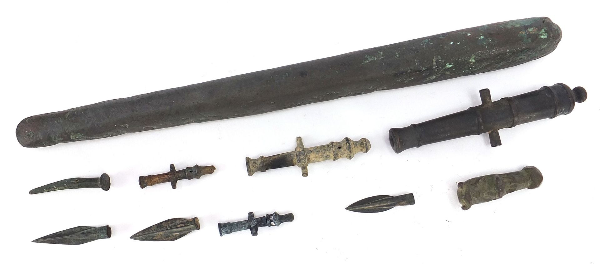 Metal antiquities including spear heads and cannon barrels, the largest 27cm in length