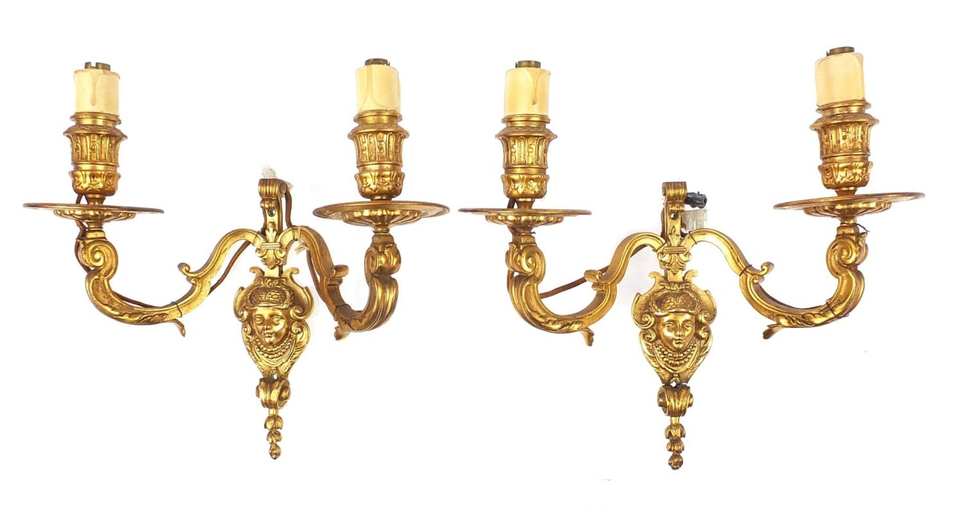 Pair of French style two branch gilt metal wall sconces with masks, 29cm high x 29cm wide