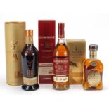 Three bottles of whiskey with boxes to include Glenmorangie, Cardhu Gold Reserve and Glenfiddich