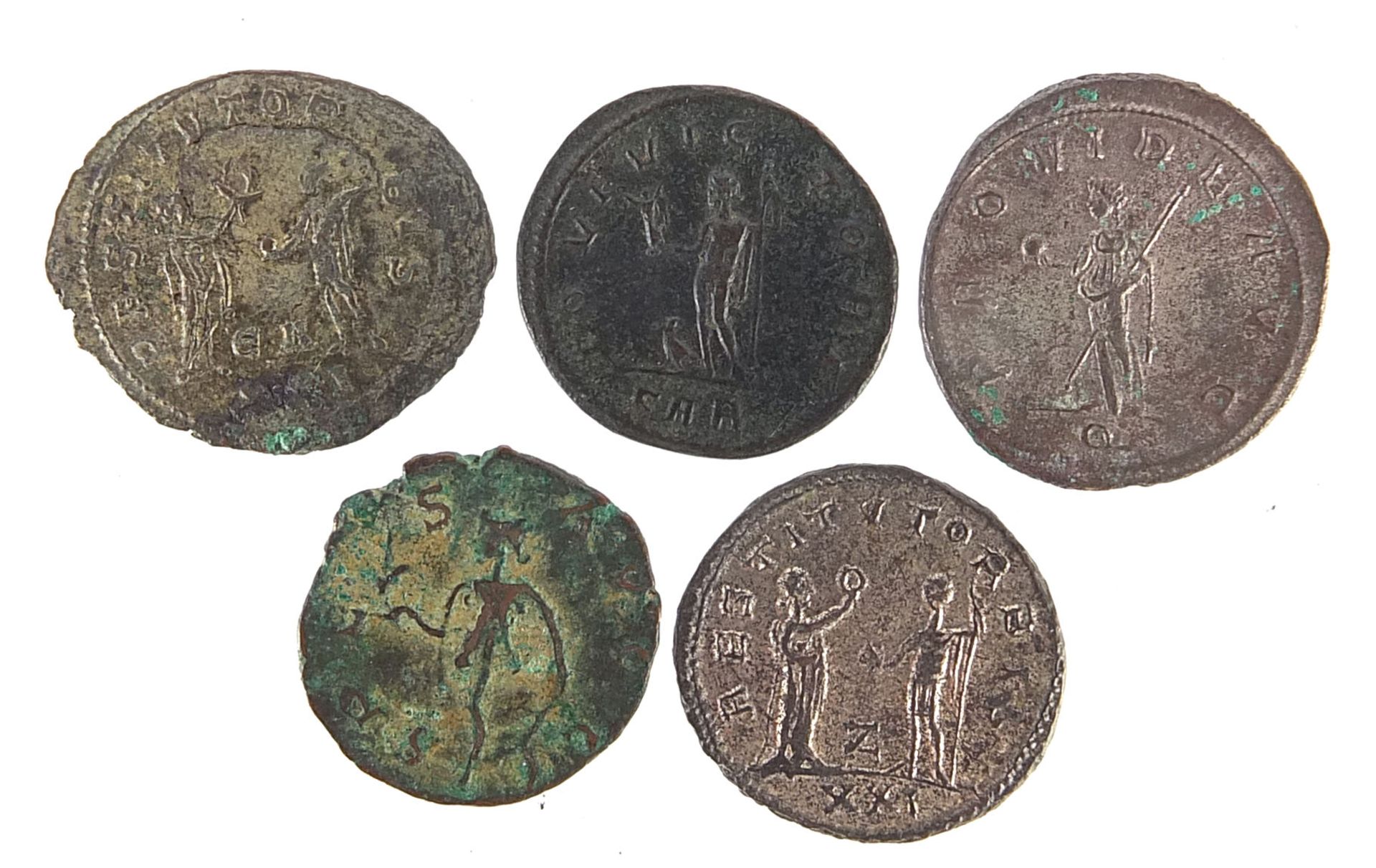 Five Roman bronze coins including Philip I and Trajan Decius examples, 17.5g, the largest 2.4cm in