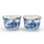 Pair of Chinese blue and white porcelain tea bowls, each hand painted with a figure on buffalo