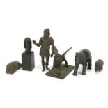 Antique Bronzes to include elephant, Greek figure, lion and a winged mythical beast, the largest