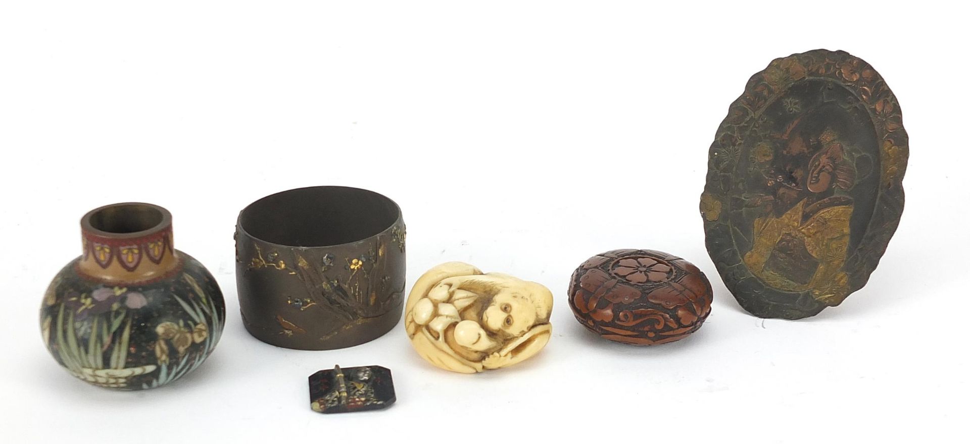 Japanese objects including an ivory toggle, mixed metal napkin ring and cloisonne vase, the