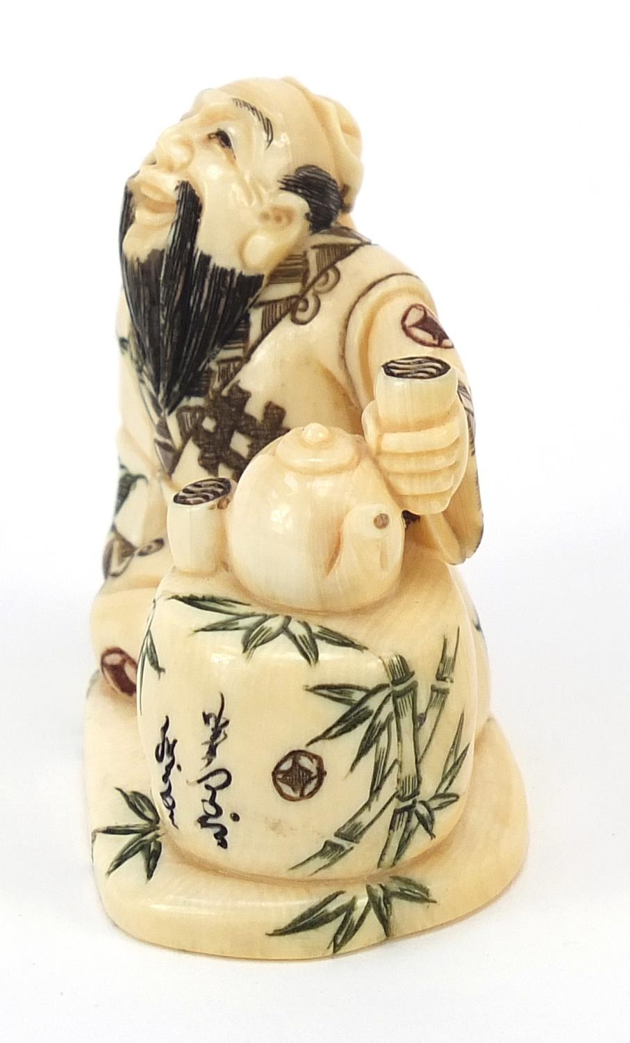 Japanese ivory netsuke of a tea seller sitting down drinking tea, character marks to the base, 4cm - Image 2 of 8