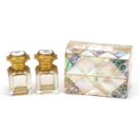 Mother of pearl and abalone domed top scent bottle box with scent bottles having gilt mounts, the