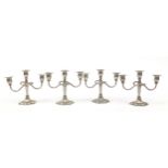 Two pairs of three branch candelabras, 21cm high