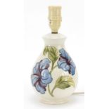 Moorcroft magnolia baluster table lamp, paper label to the base, 27cm high