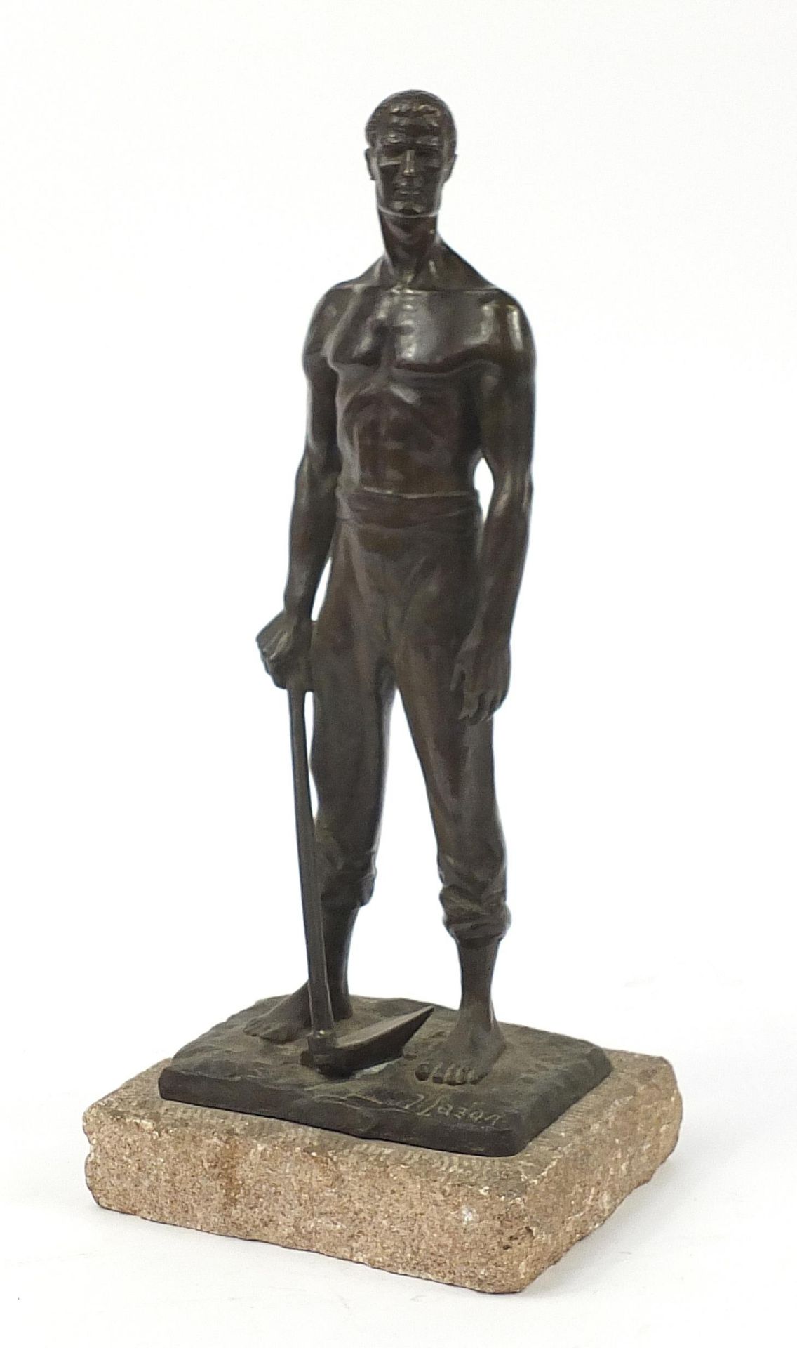 Industrial bronze figure of a workman holding a digging hoe signed N Barabotti, 43.5cm high