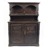 Antique oak court cupboard carved with figures feeding a griffin, dolphins and foliage, 171cm H x