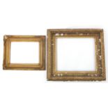 Two 19th century ornate gilt frames, the aperture sizes 56cm x 48cm and 43cm x 31.5cm