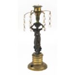 French partially gilt bronze figural candlestick with glass drops, 24cm high