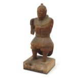 Antique wood carving of a robed man, 45cm high