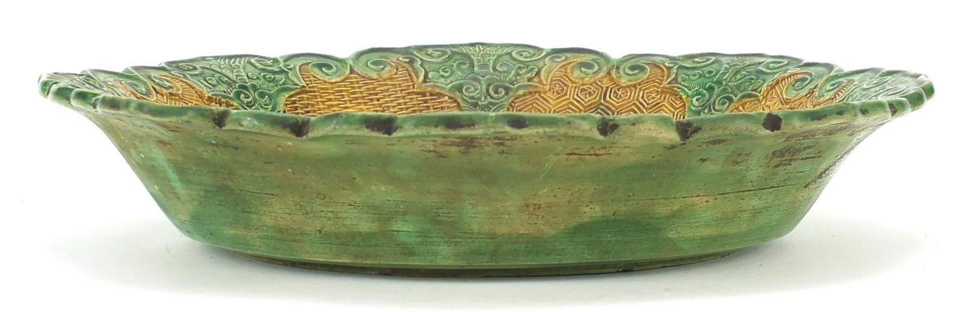Chinese green and yellow glazed porcelain dish decorated in relief with figures in a palace setting, - Image 4 of 5