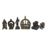 Indian bronzes including votive figures and two elephants, one raised on a rectangular black slate