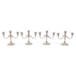 Two pairs of three branch candelabras, 21cm high